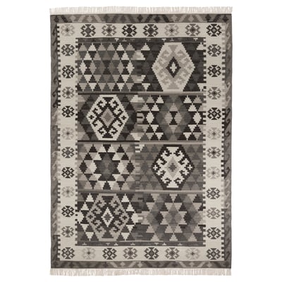 Gray wool rug, handwoven with geometric patterns, fringed edges, ideal for various rooms.