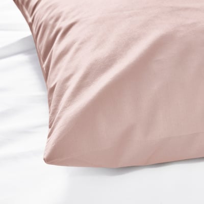 Two soft pink rectangular pillows stacked, smooth fabric, simple design.
