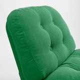 Bright green, plush, cushioned armchair backrest. Refined, inviting texture, modern yet vintage design.