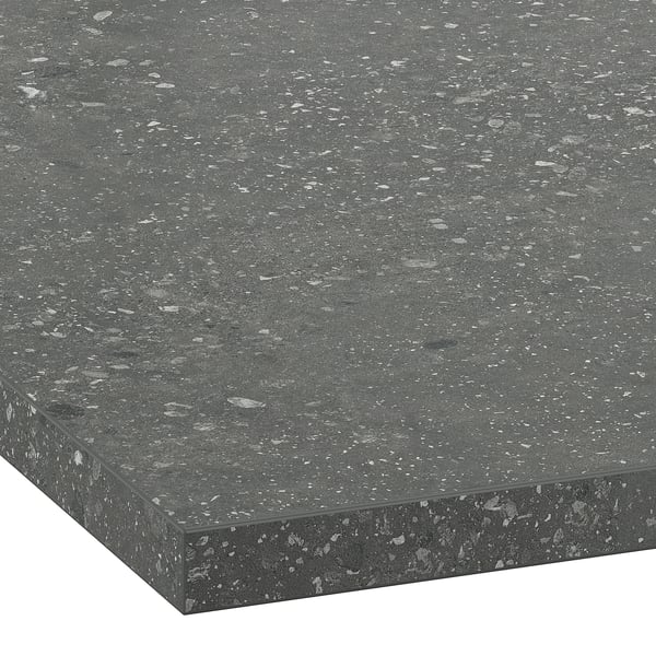 Sleek, speckled gray countertop with smooth, polished edges, showcasing durable, easy-to-clean surface.