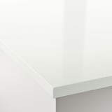 Close-up of smooth, white EKBACKEN laminate worktop corner, showcasing clean edges and glossy finish.