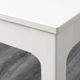 Clean, white table corner, smooth finish, sturdy build quality.