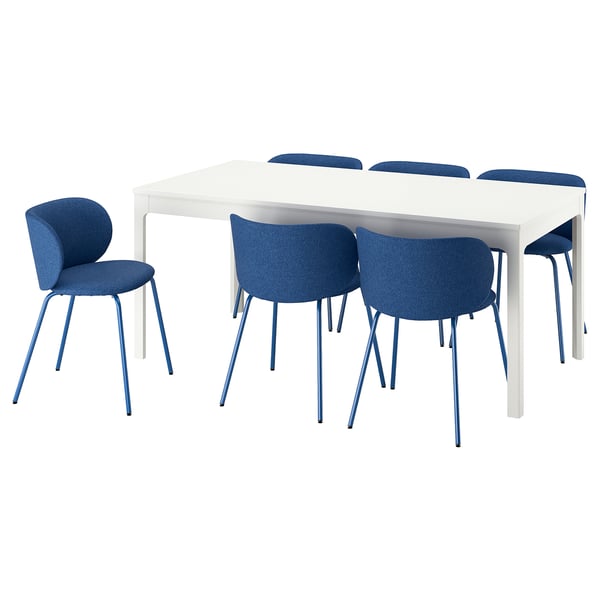 Modern white rectangular dining table with six blue cushioned chairs, sleek design, extendable.