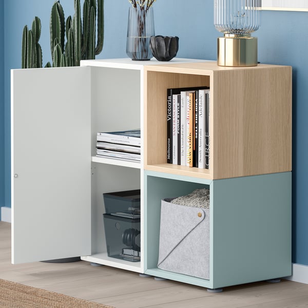 Modern storage unit with shelves and containers. Books, bins, and decor displayed neatly.
