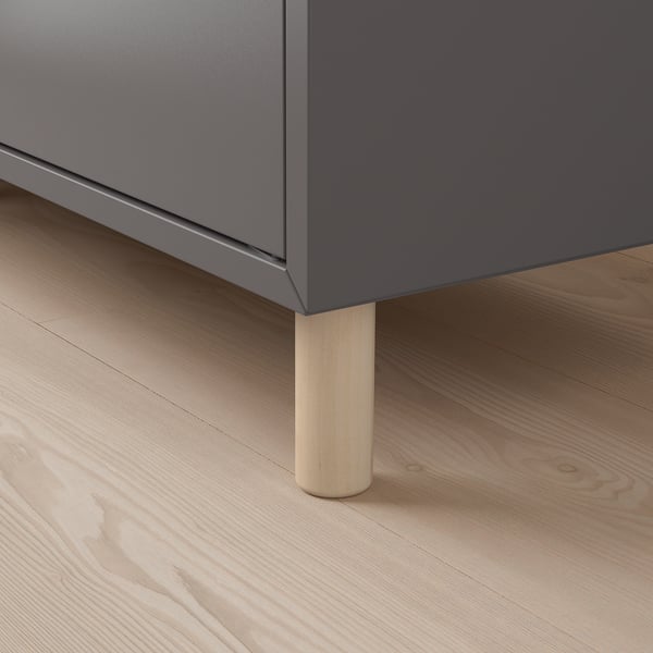 Modern storage cabinet with sleek gray finish and sturdy wooden legs.