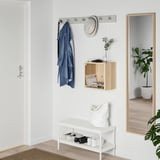 Entryway with EKET storage, shelf, bench, mirror, and plant.
