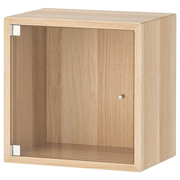 EKET: light wood cube cabinet with glass door & metal handle.