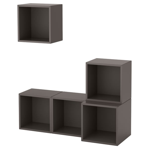 Black modular wall-mounted cube shelves. Five interconnected gray cuboidal units.