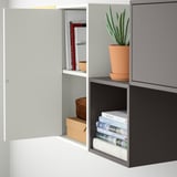 Open and closed storage combination, wall-mounted with adjustable shelves.