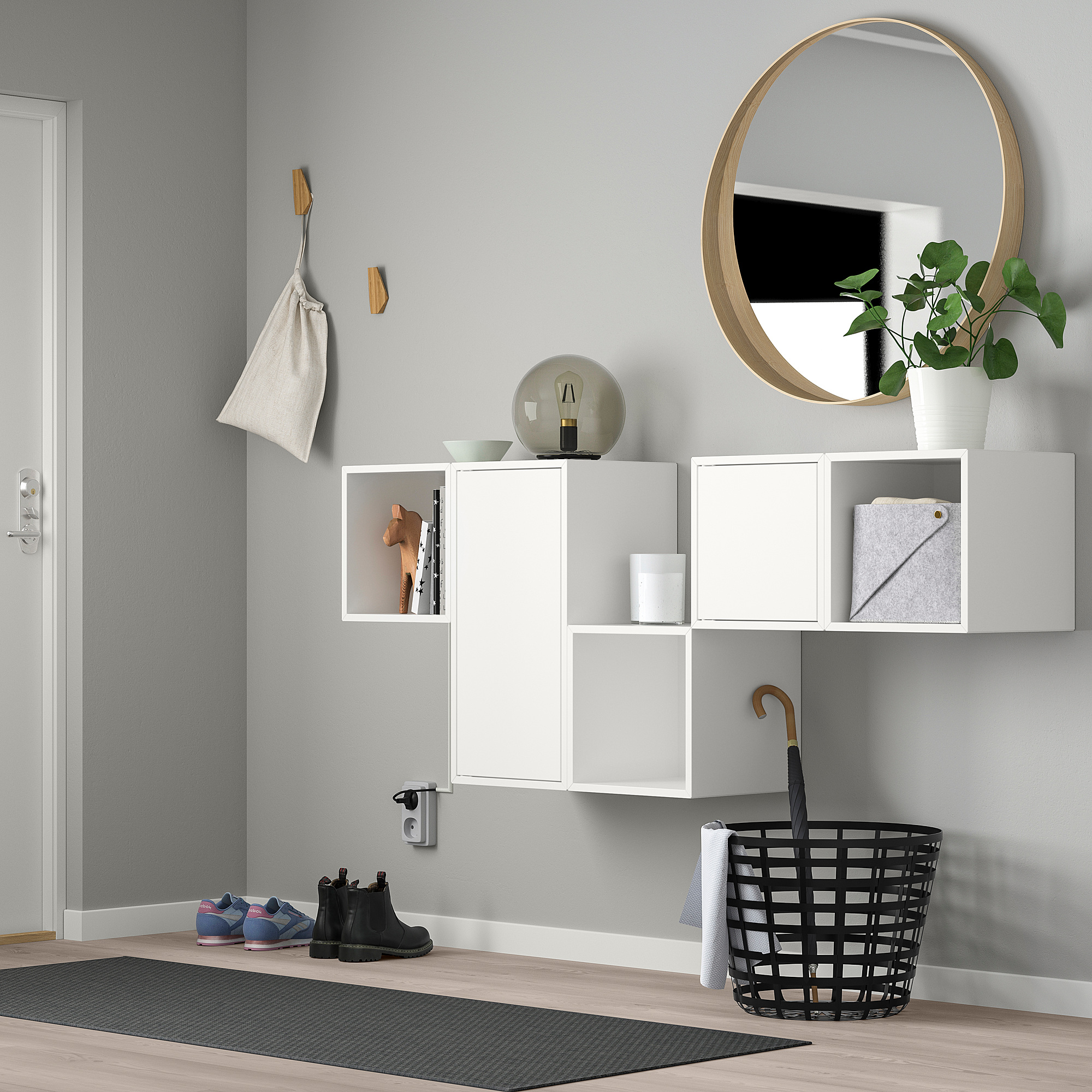 Modern entryway with EKET storage, mirror, and umbrella.
