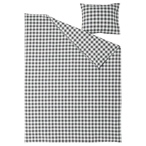 This image shows an EKTANDVINGE bed set in grey and white gingham check. The set includes a duvet cover and a pillowcase made of organic cotton.