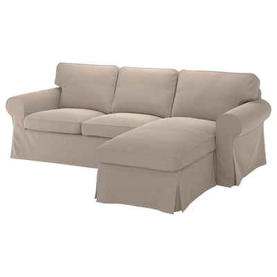 Tan EKTORP sectional sofa with rolled arms and removable cover for easy cleaning.