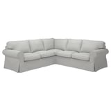 Light grey EKTORP corner sofa with plush cushions, classic rolled arms, and removable covers for easy cleaning.