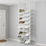 White ELVARLI shoe rack, storing various footwear on adjustable shelves against a gray wall.