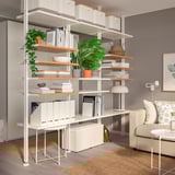 ELVARLI storage: white & bamboo shelves with books, plants. Spacious, reaches ceiling.