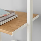 Lightweight bookshelf with bamboo shelves and white frame, ideal for space-saving and organizing items.