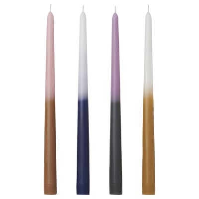 Four colorful tapered candles in brown, blue, green, and beige with fading colors, standing upright.