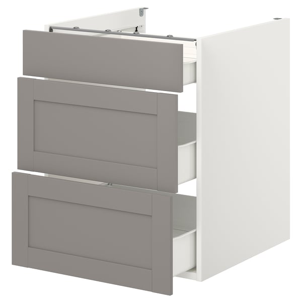An ENHET kitchen cabinet in white with grey fronts and three drawers. It has a modern, minimalist design with a sturdy build and smooth drawer slides.