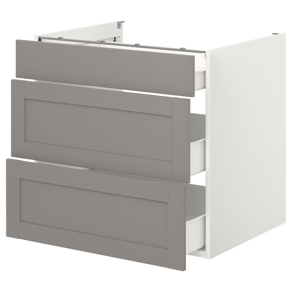 An ENHET cabinet with three grey drawers, a modern kitchen storage solution with a minimalist design and steel drawers.