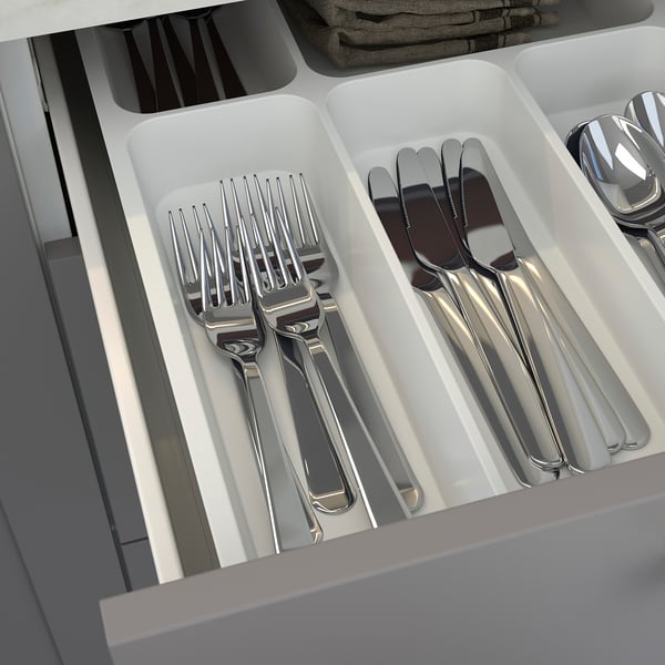 Silverware organizer drawer with forks, knives, and spoons in compartments. Part of ENHET kitchen series.