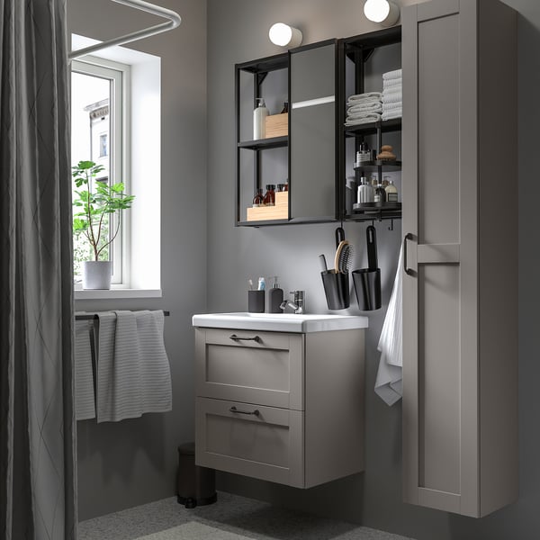 Modern grey bathroom vanity unit with mirror cabinet, sink, and storage solutions.