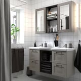 Modern gray ENHET bathroom with double vanity, open/closed storage, mirrored cabinets, and ample counter space.