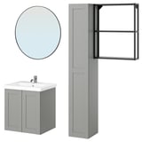 ENHET bathroom set: grey cabinet, round mirror, tall storage with shelves.