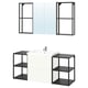 This image an ENHET bathroom setup with a white sink cabinet, black metal shelves, and a mirror cabinet.