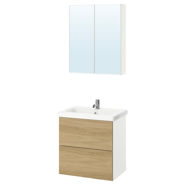 Elegant bathroom setup featuring white and oak vanity with sink, topped with mirror cabinet. Modern and practical design.