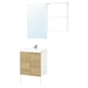 Modern bathroom vanity with light wood doors and white cabinet body, featuring a large mirror and metal fixtures.