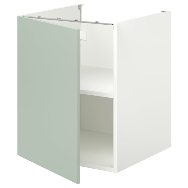 White cabinet with pale grey-green door, open showing shelf; modern, minimalist design.