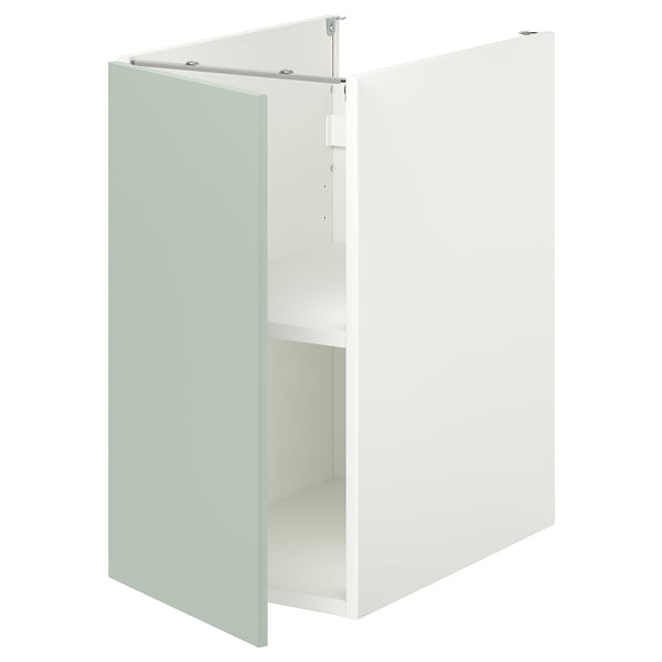 An ENHET base cabinet in pale grey-green with one open door revealing an empty shelf inside.