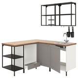Modern kitchen setup: grey cabinets, oak top, stainless steel sink, black shelves.