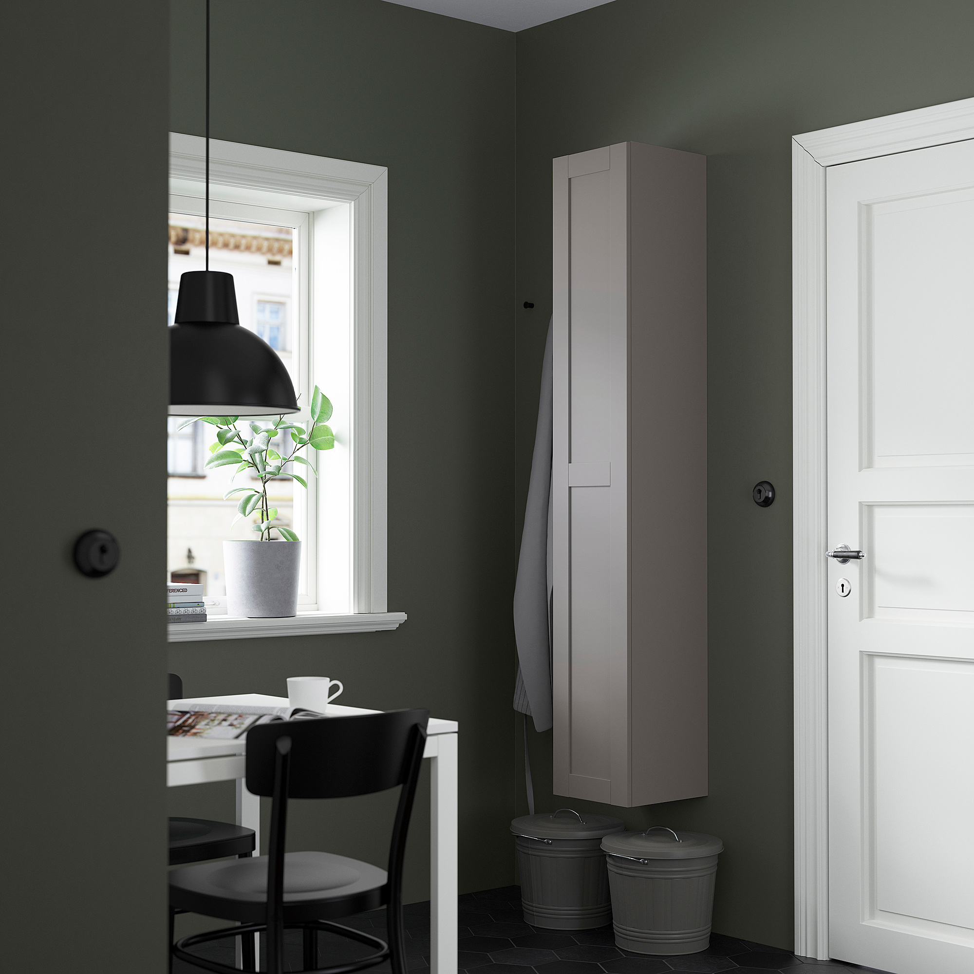 Modern room with gray ENHET cabinet, table, and plant.