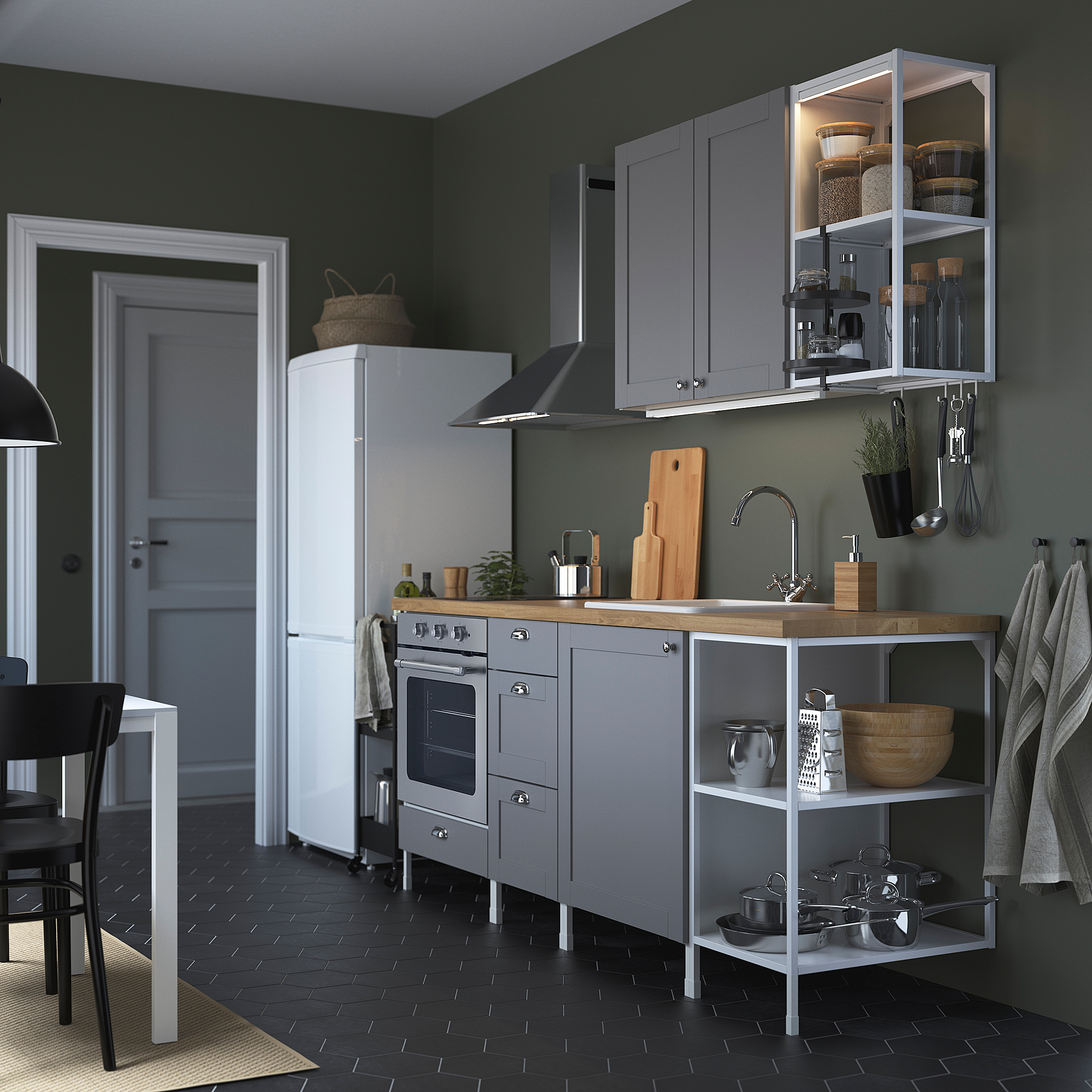 Modern gray kitchen: white fridge, gray cabinets, wooden counter, black stove. Open and closed storage, black tiles, white chairs.