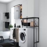Modern white laundry room with ENHET units, washing machine, iron and shelves.