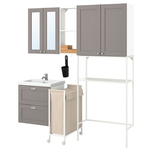 Gray ENHET bathroom set: vanity, laminate cabinets, metal shelves, beige hanging bag, mirror, black toothbrush holder.
