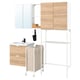 ENHET bathroom/laundry combo: light wood cabinet, white sink, black faucet, mirror, laundry bag, hooks.