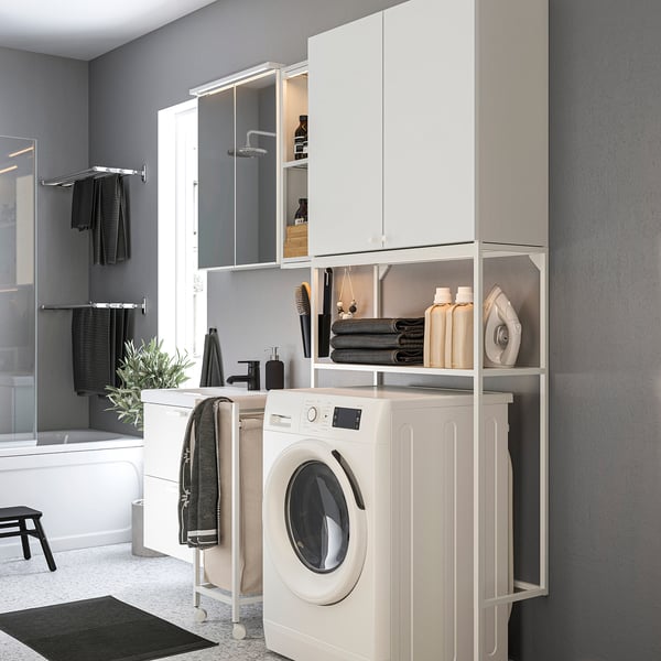 Laundry-bathroom combo: ENHET cabinet, washer, towels, iron, shower.