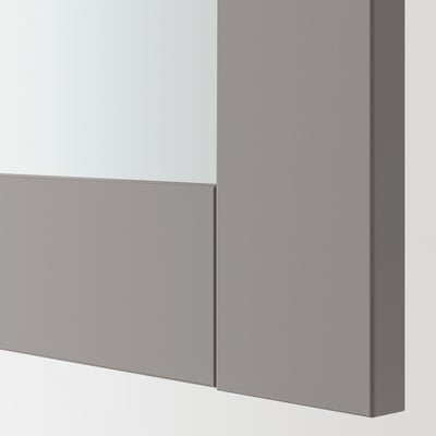 Close-up of modern, high-quality bathroom mirror with sleek grey frame.