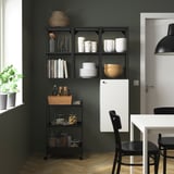 Dark ENHET kitchen storage unit with shelves and cabinet for dishes and glasses.