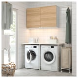 Modern laundry room with ENHET cabinets, appliances, and drying clothes.