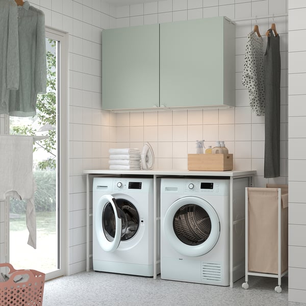 Laundry room with washing machine, dryer, ENHET counter & storage.