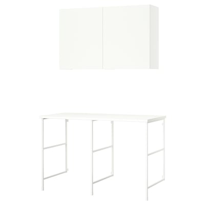 White ENHET laundry setup with countertop and wall storage, modern design.