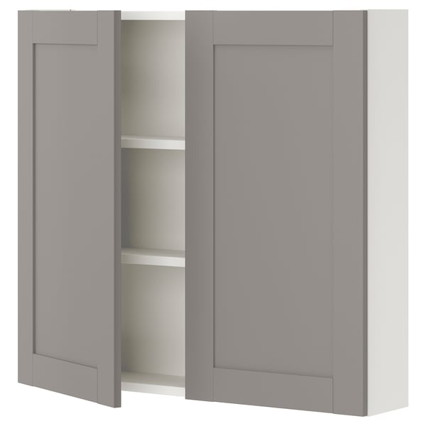 ENHET grey wall cabinet with two shelves. Sleek, rectangular design, modern style for kitchen or bathroom storage.