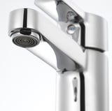Modern chrome faucet with sleek, curved design and built-in aerator; part of high-quality ENSEN brand.