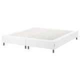 A white ESPEVÄR bed base with smooth upholstery and metallic legs. Raised design for comfort and support.