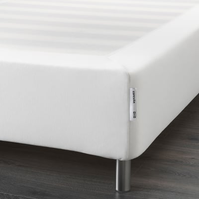 Close-up of an espevår mattress base, showcasing its height and stainless steel legs, designed for easy access and support.