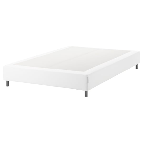 White espevar bed base, upholstered, rectangular, raised on metal legs.
