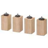 Four light brown wooden blocks with black circular attachments on top, arranged in a row, isolated on white.